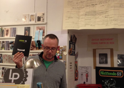 Présentation de la revue Ligne 13 par Alain Cressan, lors du lancement des posters de Alain Cressan et de Pierre Ménard samedi 15 novembre 2014 à la Librairie Le Lièvre de Mars, à Marseille.